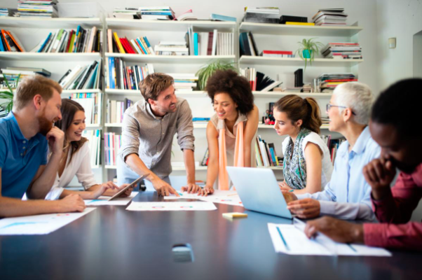 7 adults at the table for a meeting