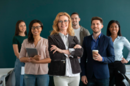 6  adults standing in front of a chalkboard